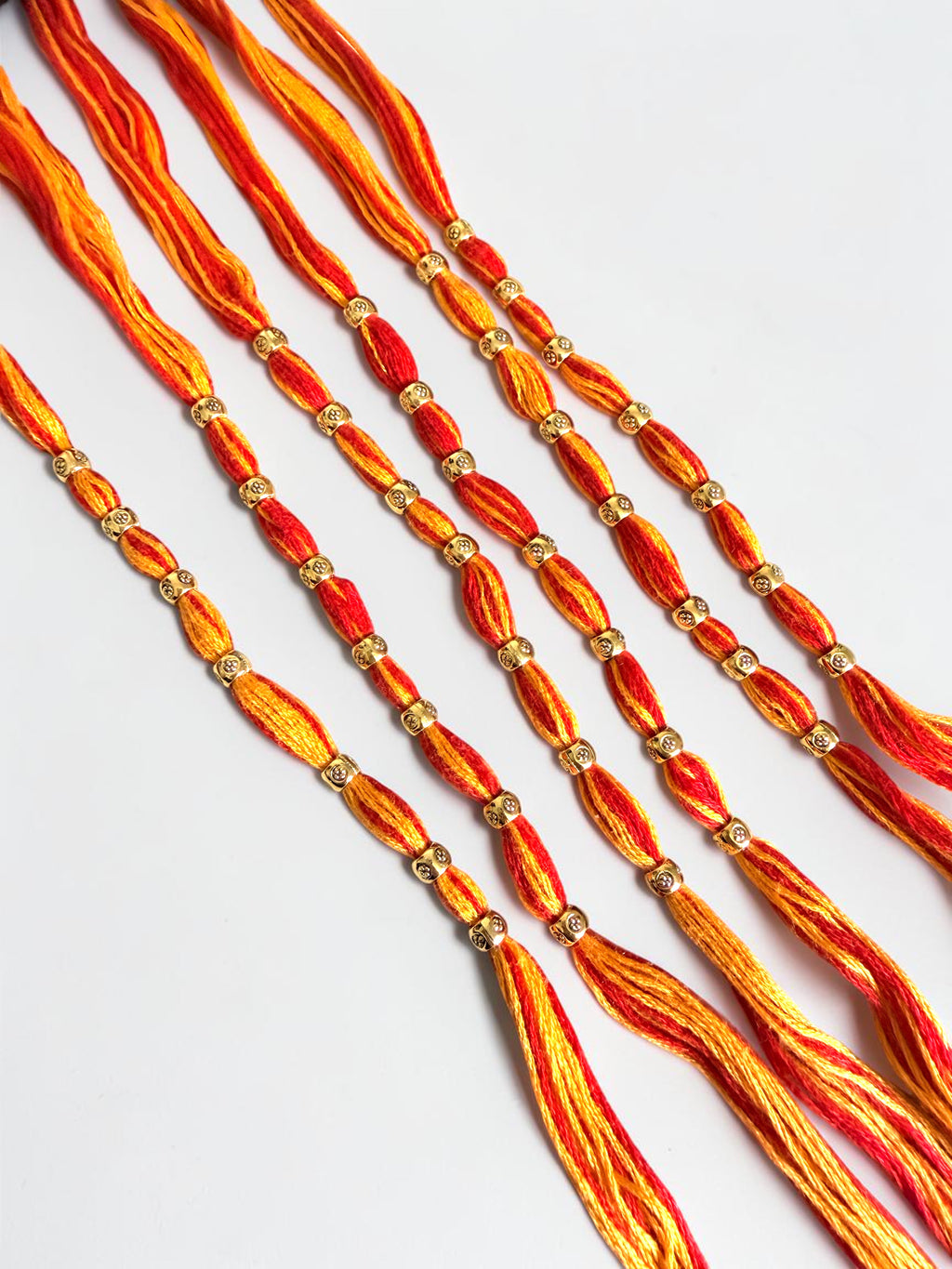 Pack of 6 Traditional Red and Orange Thread Rakhis