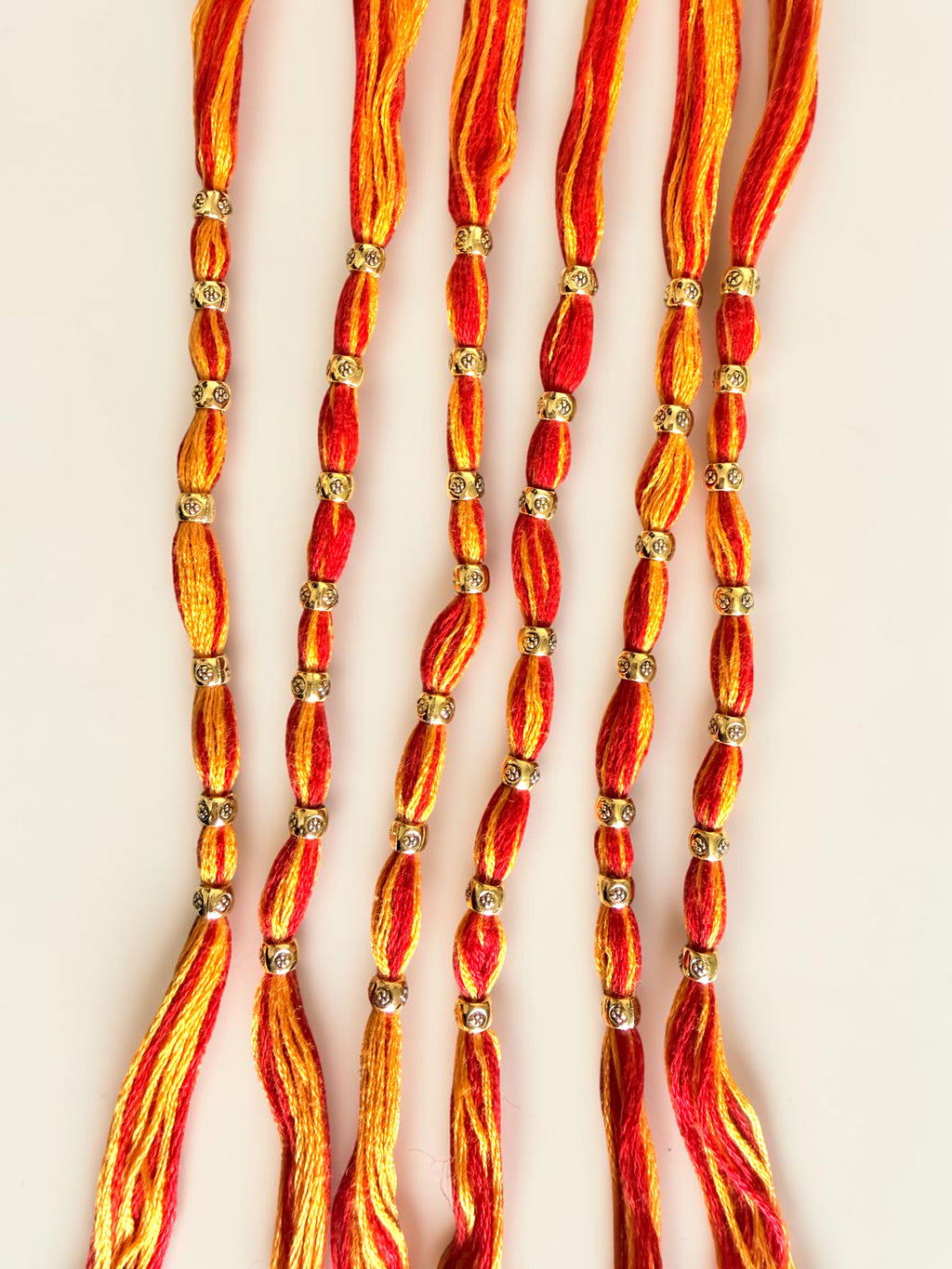 Pack of 6 Traditional Red and Orange Thread Rakhis