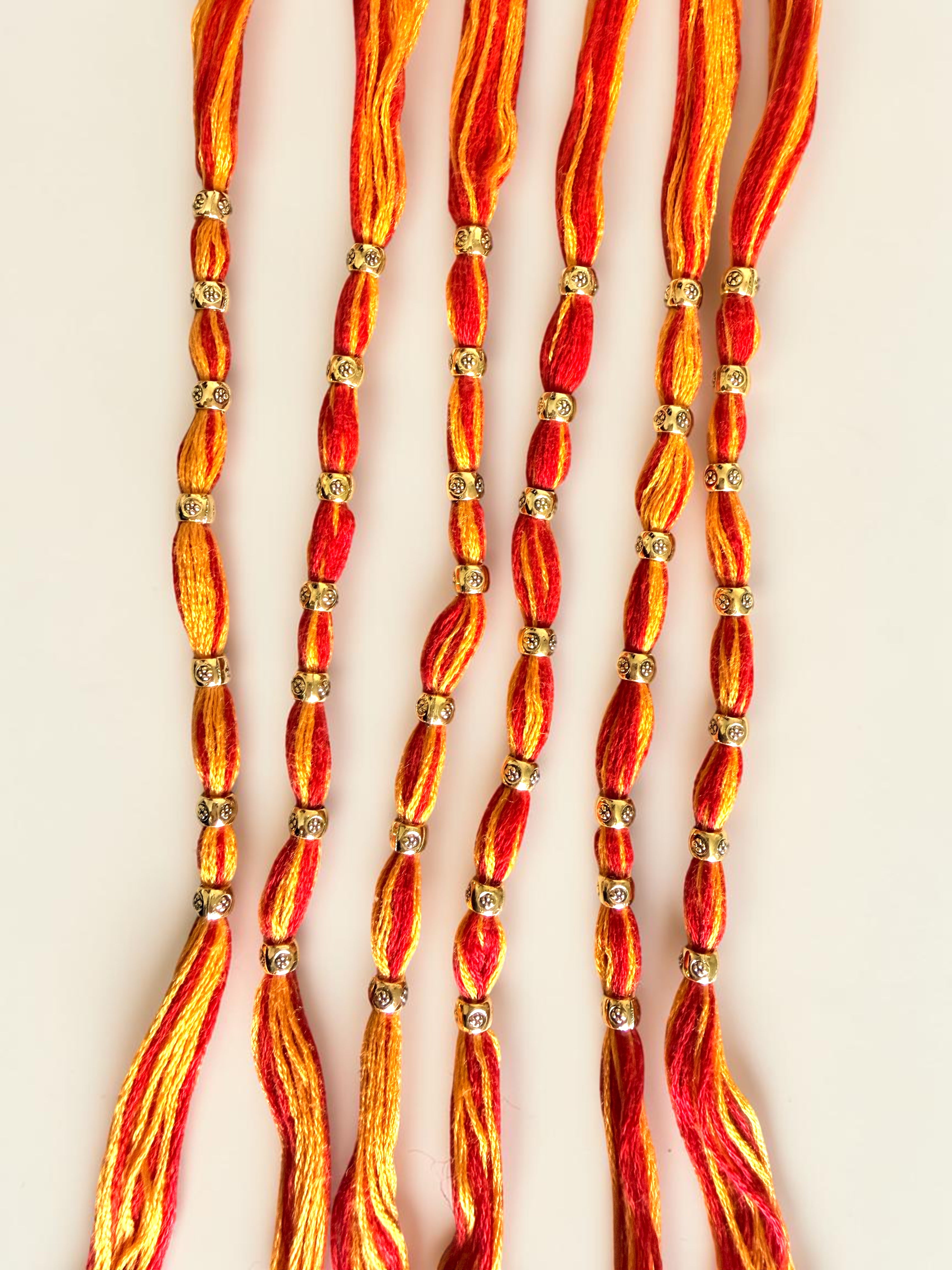 Pack of 6 Traditional Red and Orange Thread Rakhis