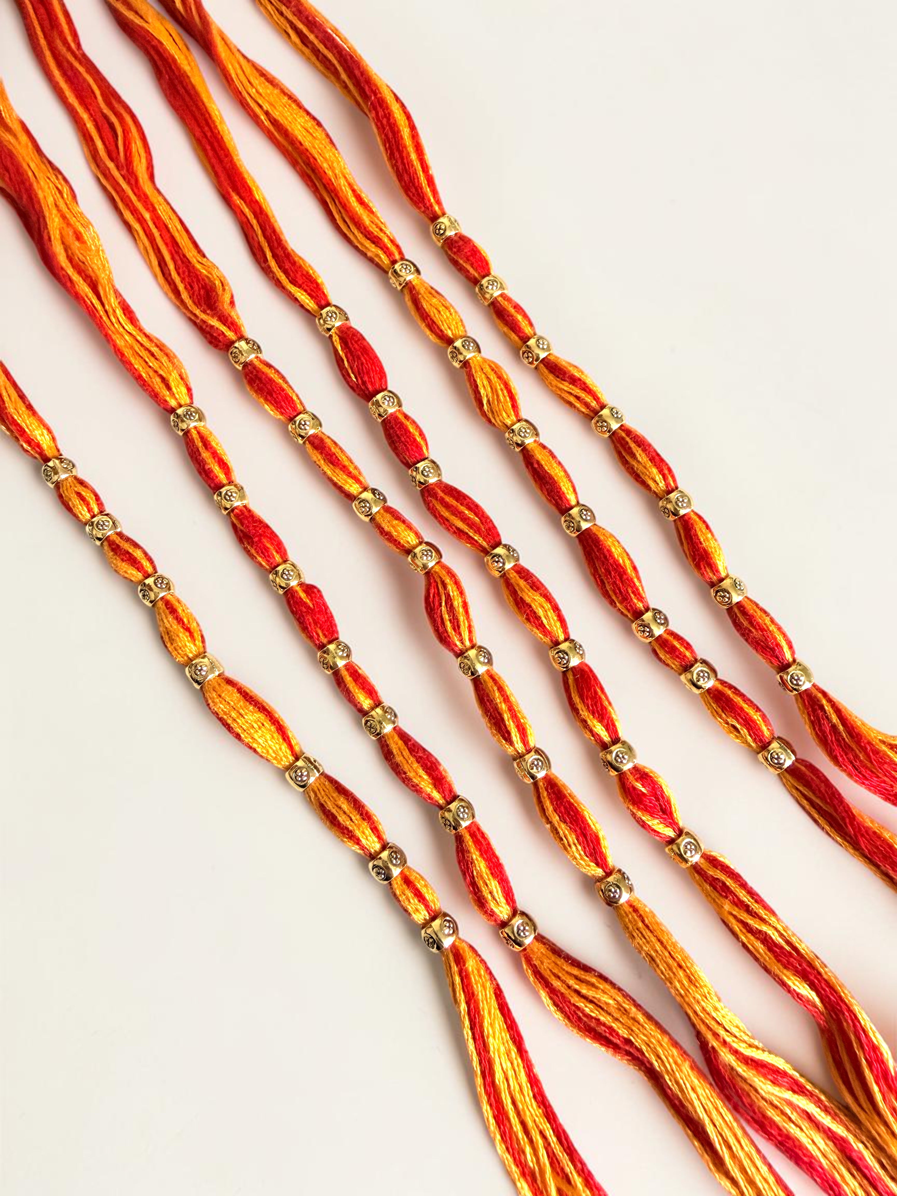 Pack of 6 Traditional Red and Orange Thread Rakhis